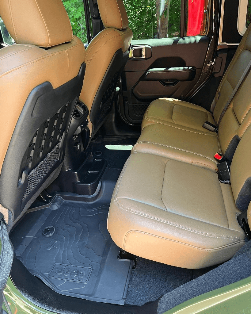 Spotless tan leather interior of a Jeep after professional detailing